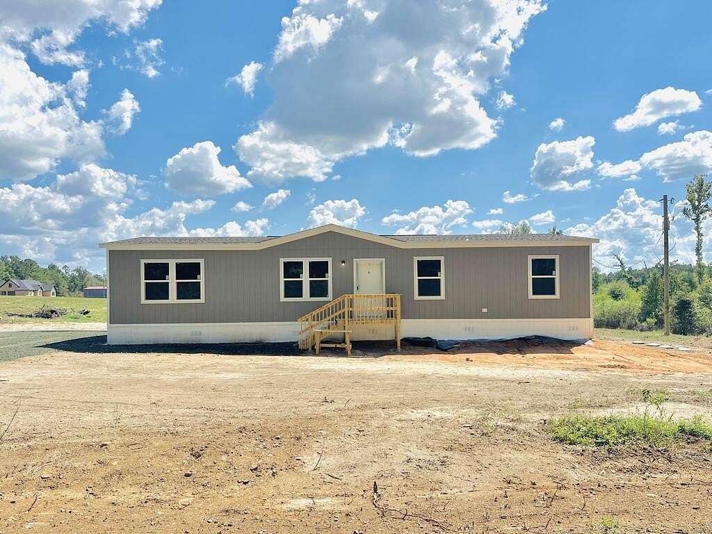 3 Acres of Land with Home for Sale in Carthage, Texas
