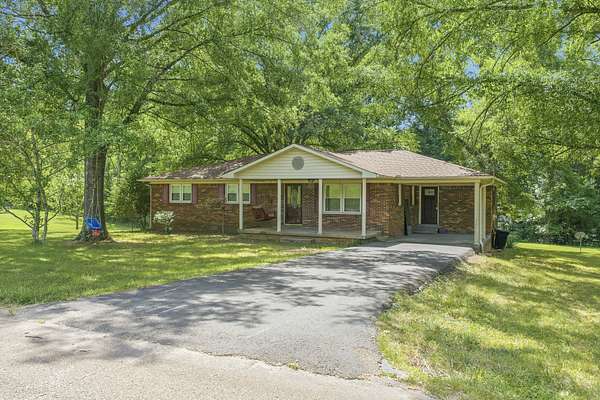 5.9 Acres of Land with Home for Sale in Parsons, Tennessee