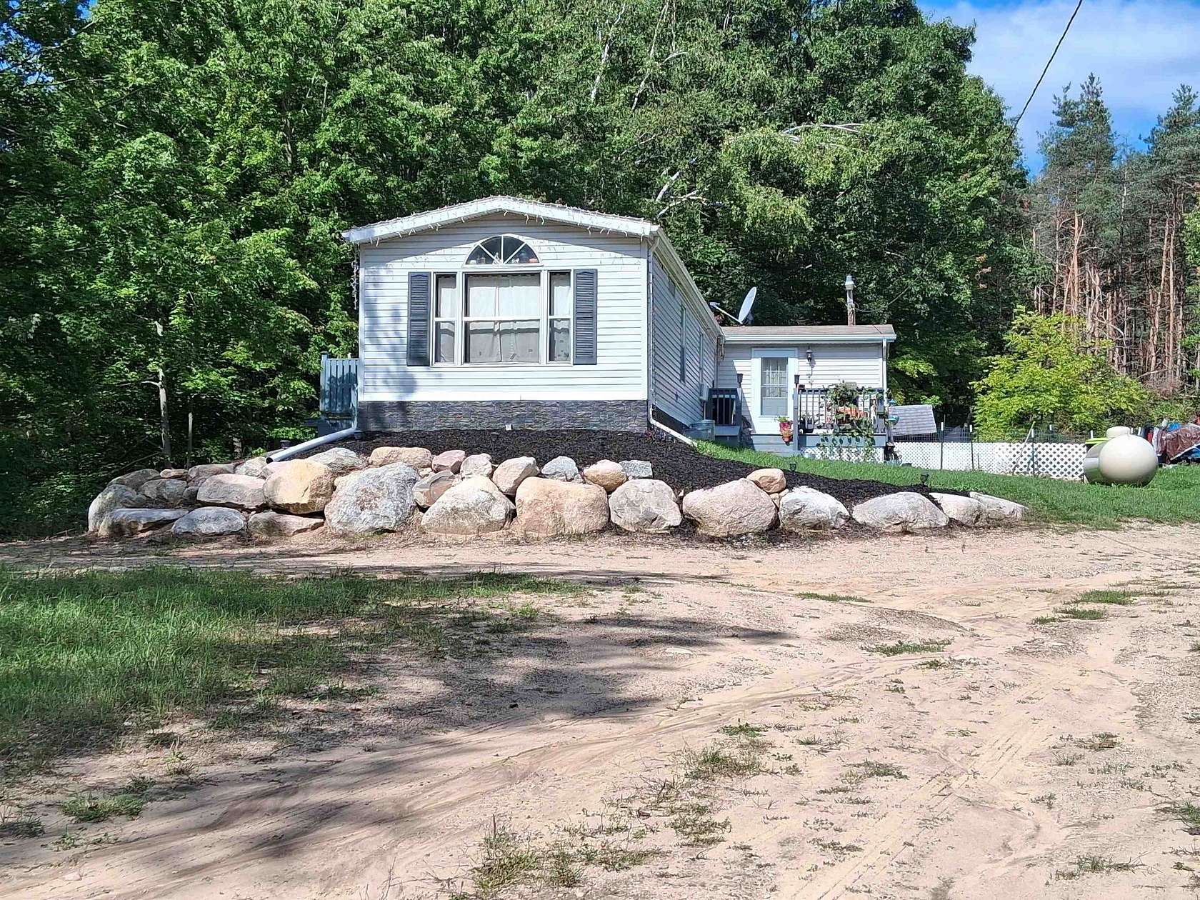 2 Acres of Land with Home for Sale in Farwell, Michigan