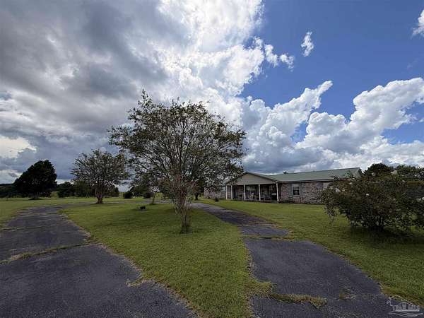 5.45 Acres of Land with Home for Sale in Molino, Florida