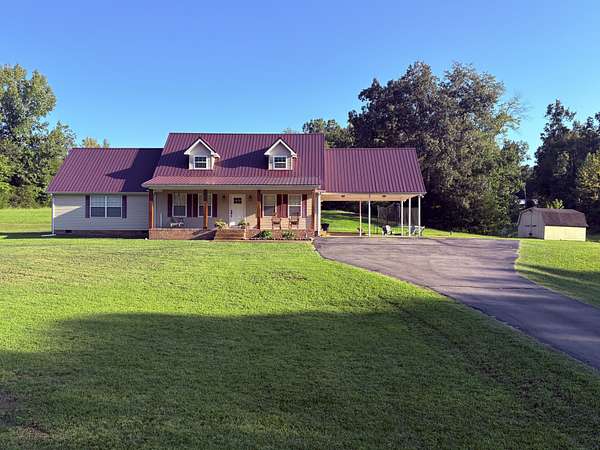 5.55 Acres of Land with Home for Sale in Hohenwald, Tennessee