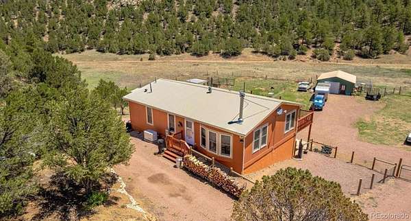 12.1 Acres of Recreational Land with Home for Sale in Cotopaxi, Colorado