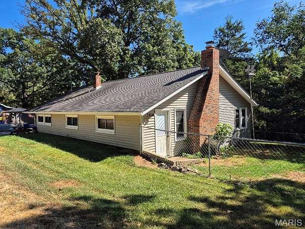 27.7 Acres of Land with Home for Sale in De Soto, Missouri