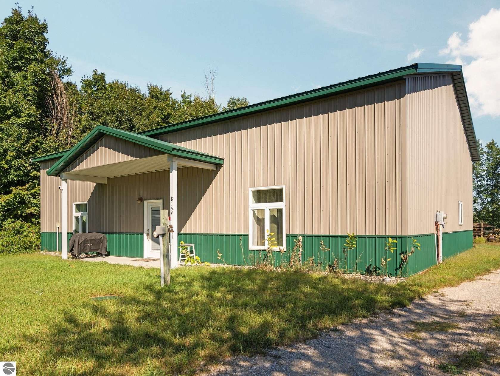 3.66 Acres of Land with Home for Sale in Williamsburg, Michigan