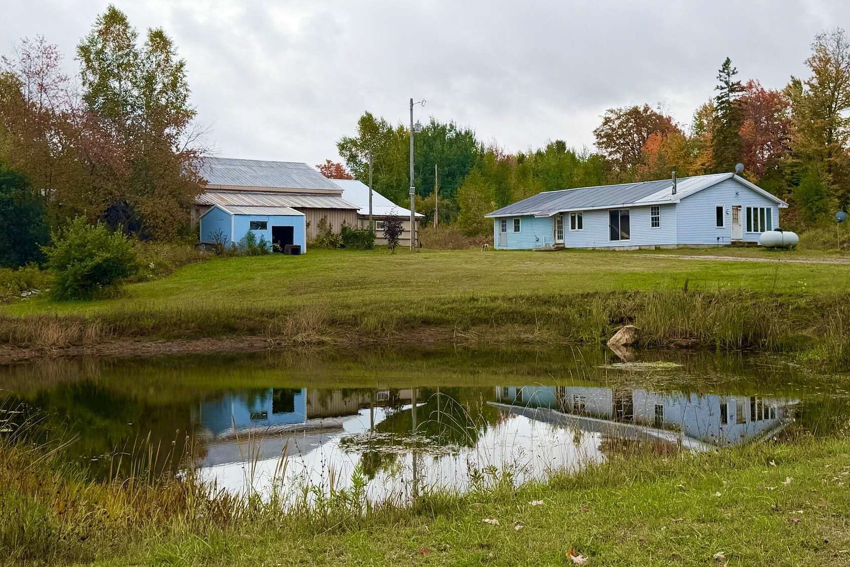 6.87 Acres of Land with Home for Sale in McMillan, Michigan