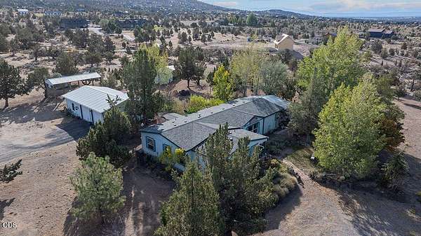 4.85 Acres of Land with Home for Sale in Powell Butte, Oregon