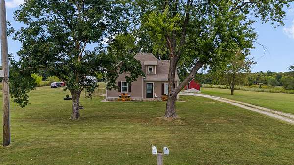 5.76 Acres of Land with Home for Sale in New Bloomfield, Missouri