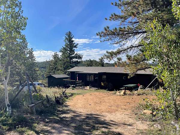 1.64 Acres of Land with Home for Sale in Red Feather Lakes, Colorado