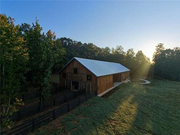 23 Acres of Land with Home for Sale in Ball Ground, Georgia