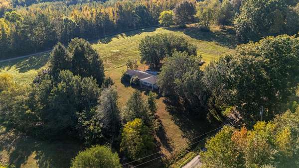 20.1 Acres of Land with Home for Sale in Leoma, Tennessee