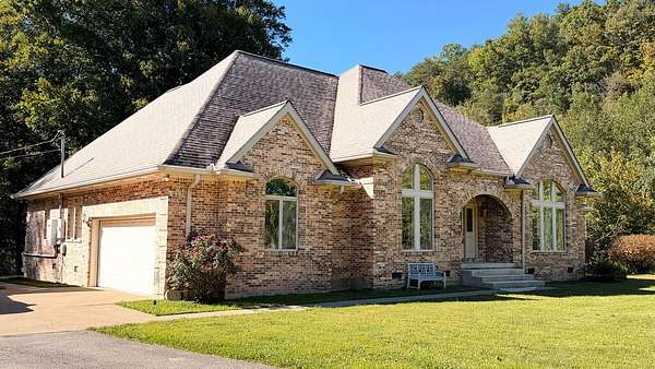 16.9 Acres of Land with Home for Sale in Staffordsville, Kentucky