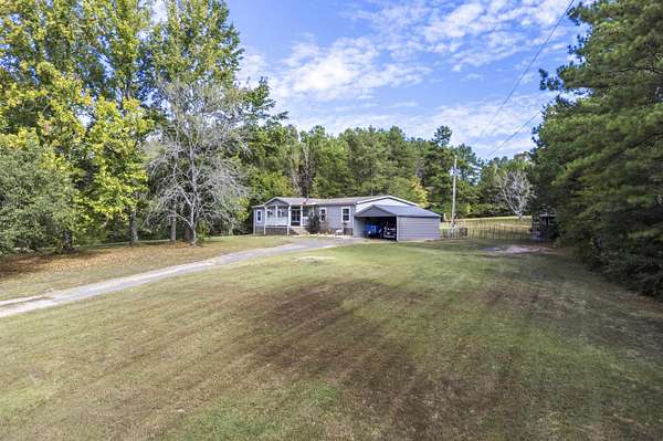 4.4 Acres of Land with Home for Sale in Somerville, Tennessee