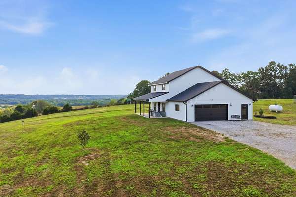 20.4 Acres of Land with Home for Sale in Niangua, Missouri
