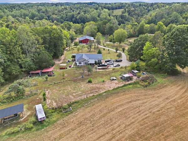 70.3 Acres of Recreational Land with Home for Auction in Red Boiling Springs, Tennessee