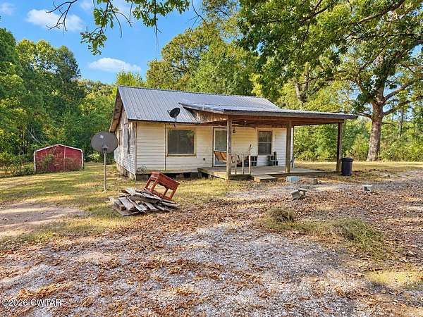 7.4 Acres of Land with Home for Sale in Bruceton, Tennessee