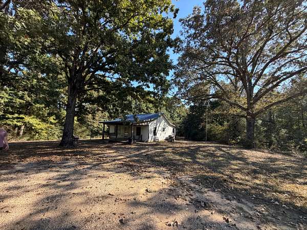 7.4 Acres of Land with Home for Sale in Bruceton, Tennessee