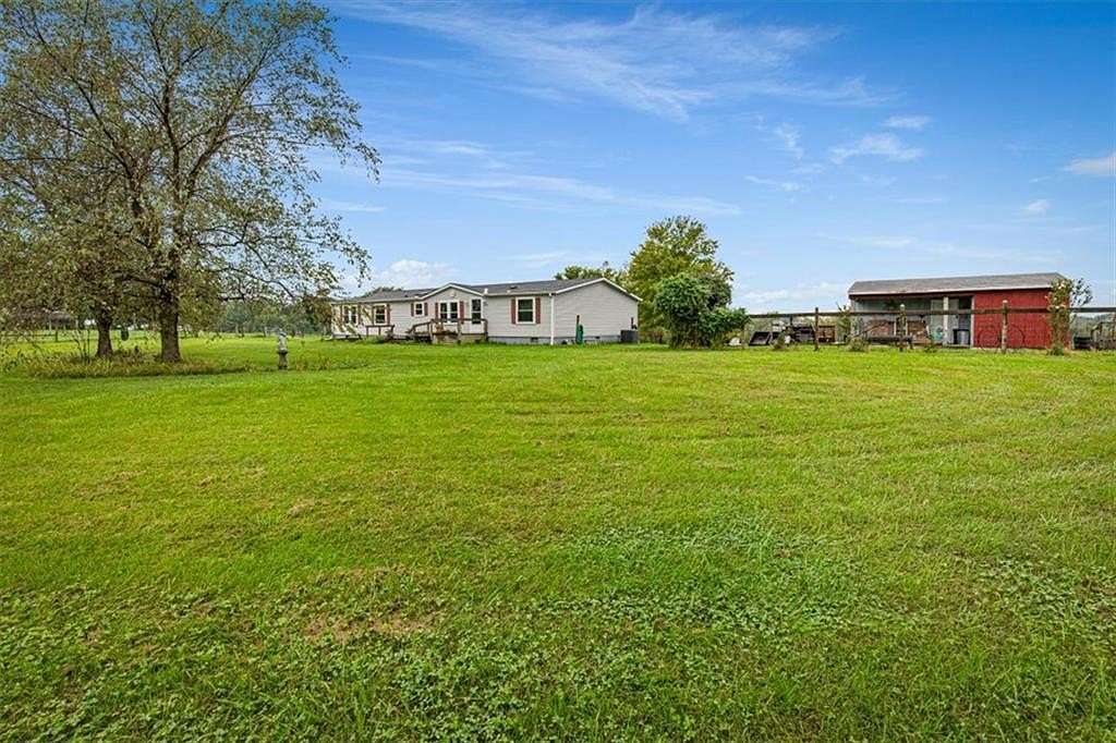 6.3 Acres of Land with Home for Sale in Lathrop, Missouri