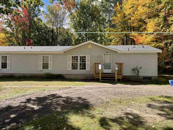 10 Acres of Land with Home for Sale in Harrison, Michigan