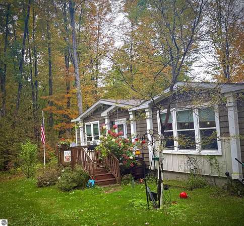 8.5 Acres of Land with Home for Sale in Bellaire, Michigan