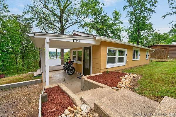 5.8 Acres of Land with Home for Sale in Barnett, Missouri