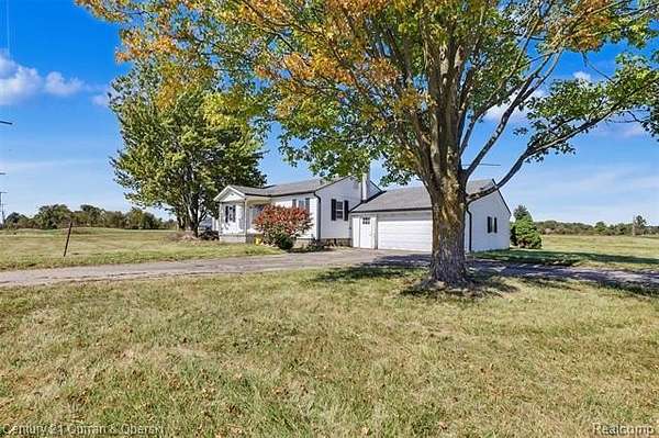 7 Acres of Land with Home for Sale in Casco Township, Michigan
