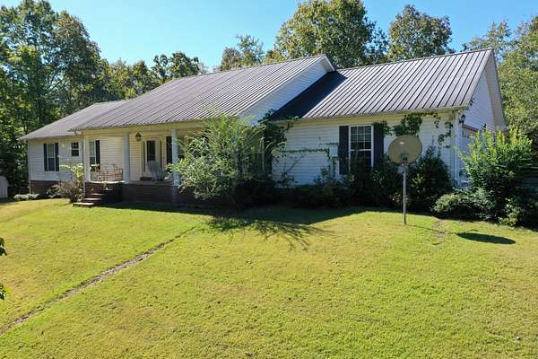 12.3 Acres of Land with Home for Auction in Linden, Tennessee