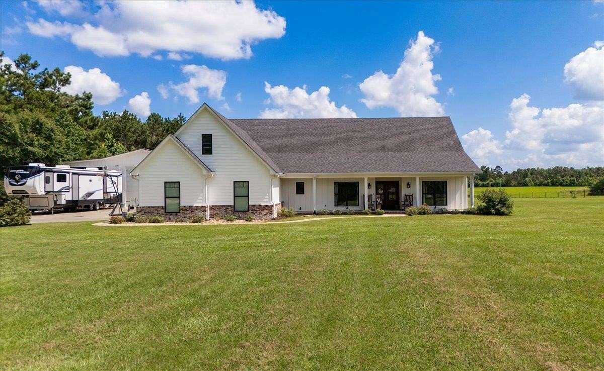 3 Acres of Land with Home for Sale in Carthage, Texas