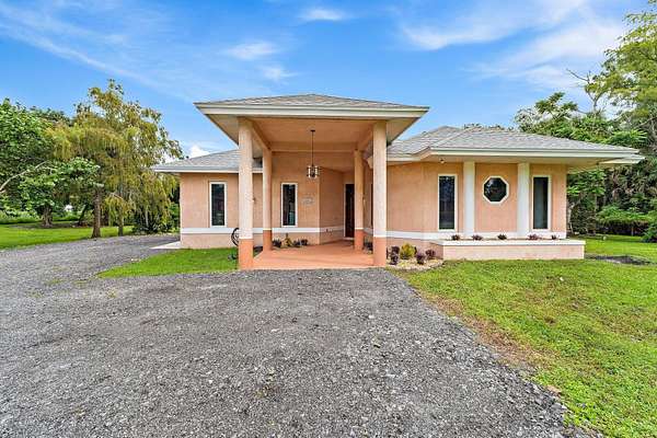 1.65 Acres of Land with Home for Sale in Loxahatchee Groves, Florida