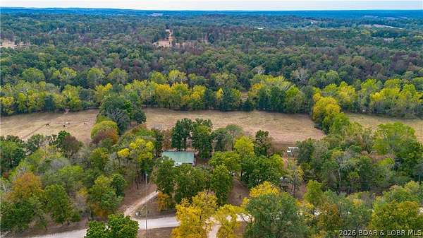 10 Acres of Land with Home for Sale in Brumley, Missouri