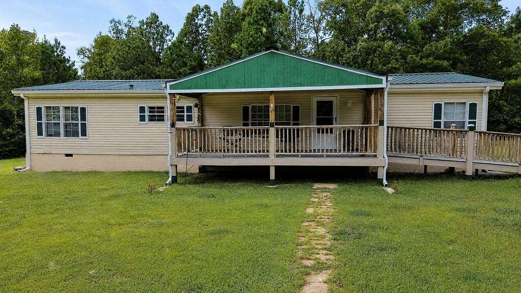 21.8 Acres of Recreational Land with Home for Sale in Camden, Tennessee