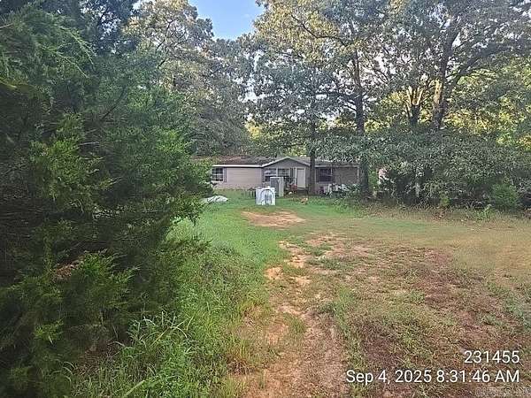 4.36 Acres of Land with Home for Sale in Romance, Arkansas