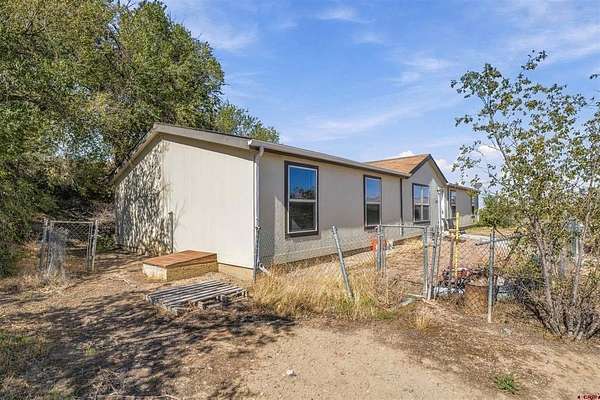 2.46 Acres of Land with Home for Sale in Grand Junction, Colorado