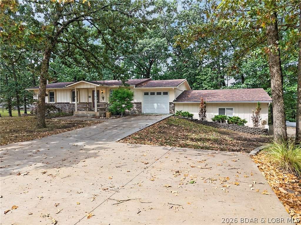1.68 Acres of Land with Home for Sale in Laurie, Missouri