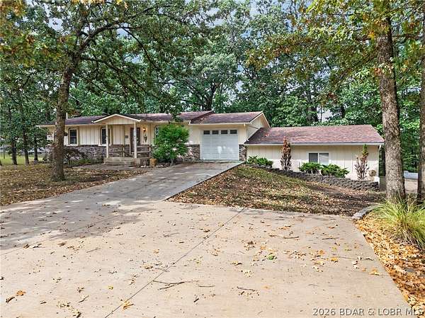 1.68 Acres of Land with Home for Sale in Laurie, Missouri