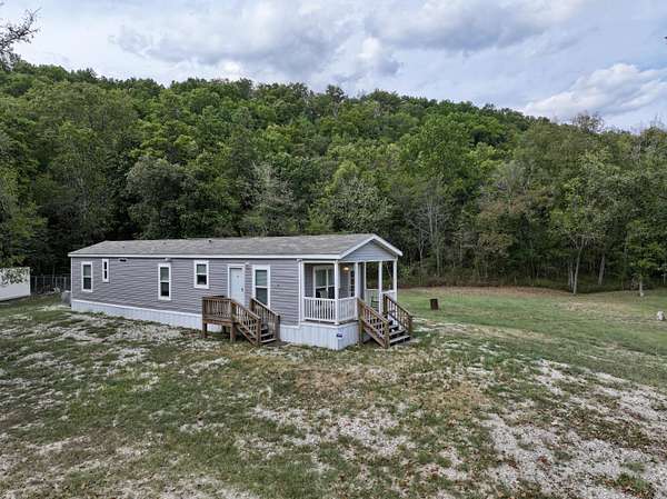 1.77 Acres of Land with Home for Sale in Fremont, Missouri