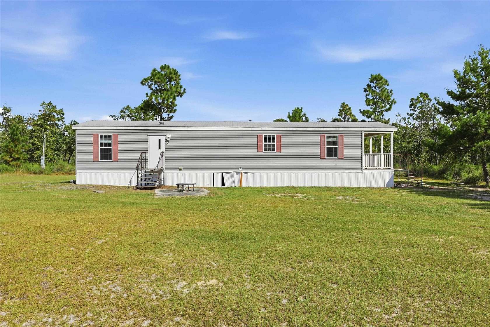 17.8 Acres of Land with Home for Auction in Altha, Florida