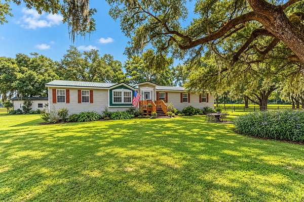 69 Acres of Agricultural Land with Home for Sale in Chiefland, Florida