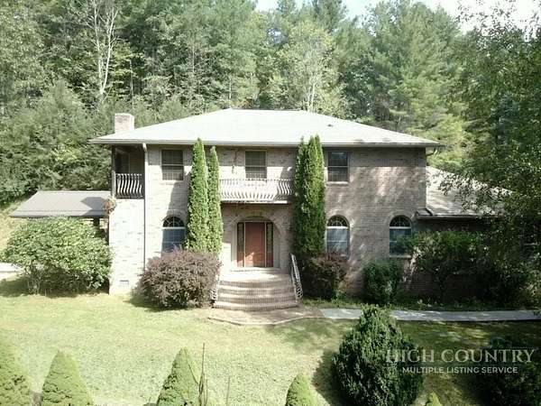6 Acres of Land with Home for Sale in Grassy Creek, North Carolina