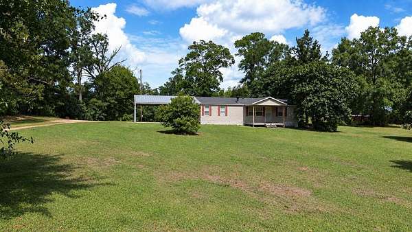 6.18 Acres of Land with Home for Sale in Kirbyville, Texas