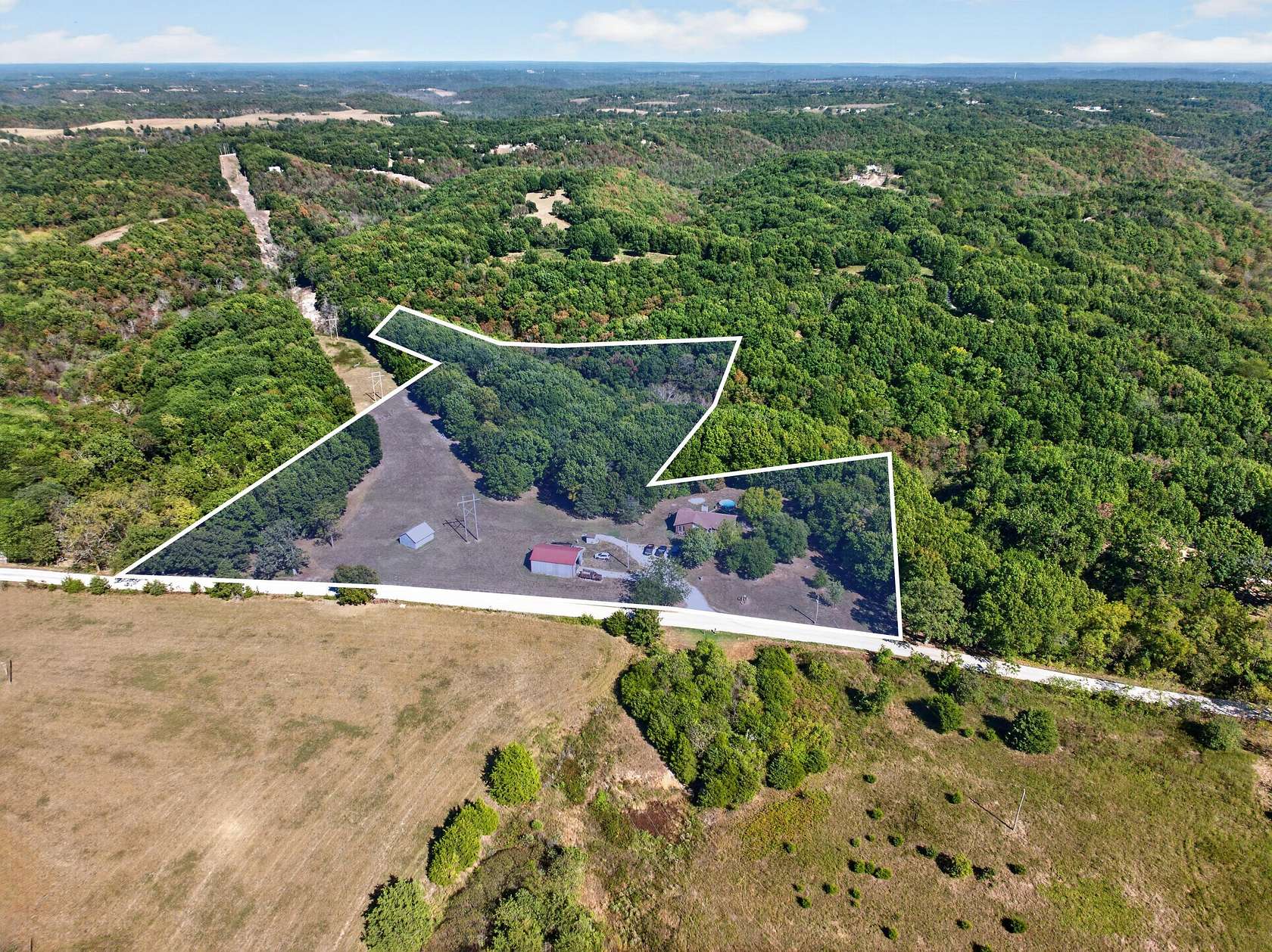 10 Acres of Land with Home for Sale in Reeds Spring, Missouri