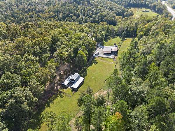 20.8 Acres of Land with Home for Sale in Louisa, Kentucky