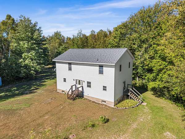 50 Acres of Recreational Land with Home for Sale in Carp Lake, Michigan
