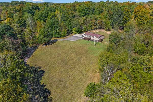 5.33 Acres of Land with Home for Sale in Southside, Tennessee