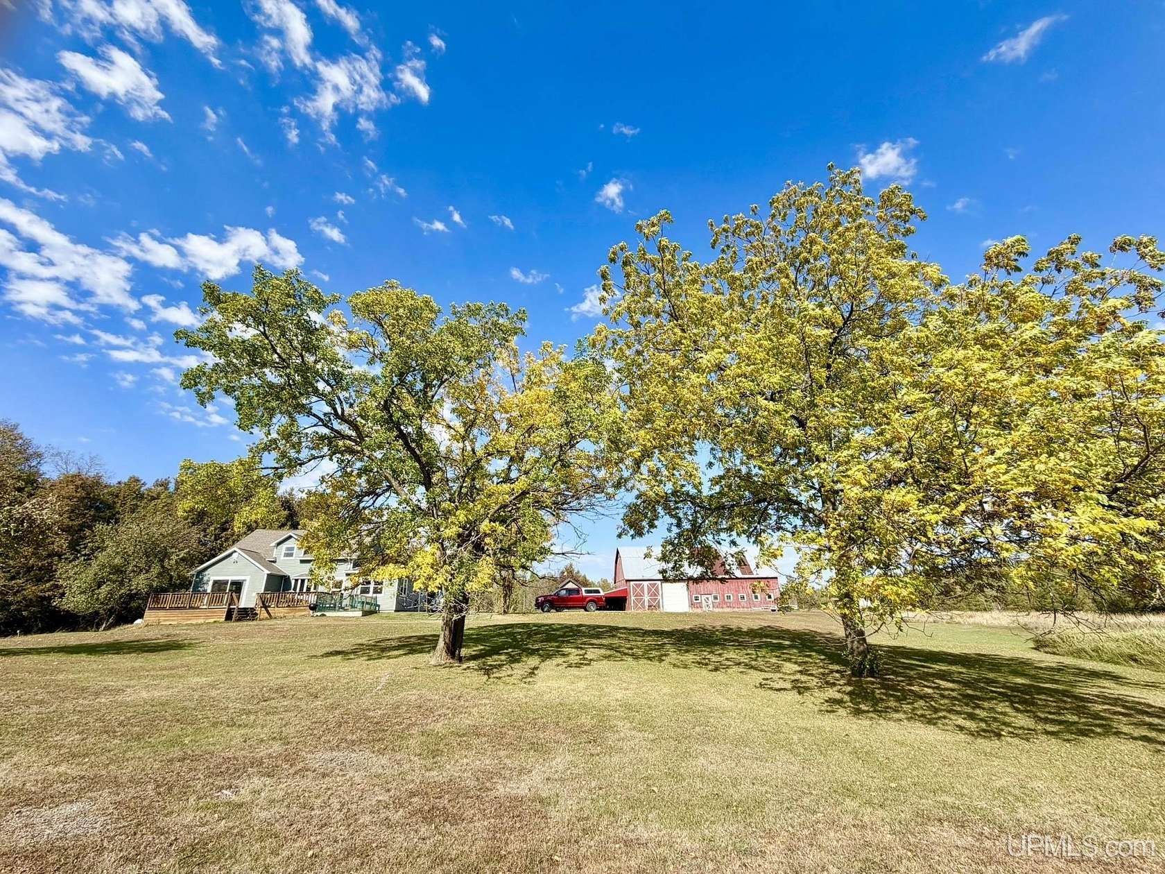 22.2 Acres of Land with Home for Sale in Powers, Michigan