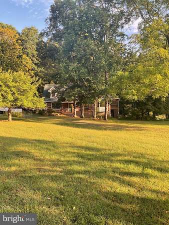 10.4 Acres of Land with Home for Sale in Paw Paw, West Virginia