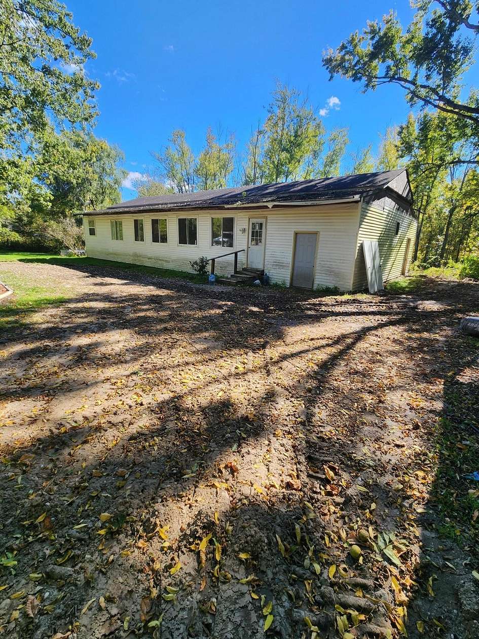 2.5 Acres of Land with Home for Sale in Saranac, Michigan