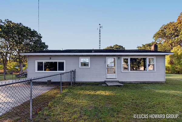 1.66 Acres of Land with Home for Sale in Norton Shores, Michigan