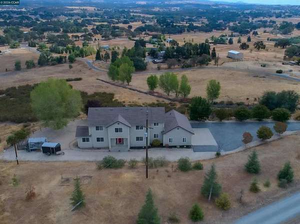 5.1 Acres of Land with Home for Sale in Valley Springs, California