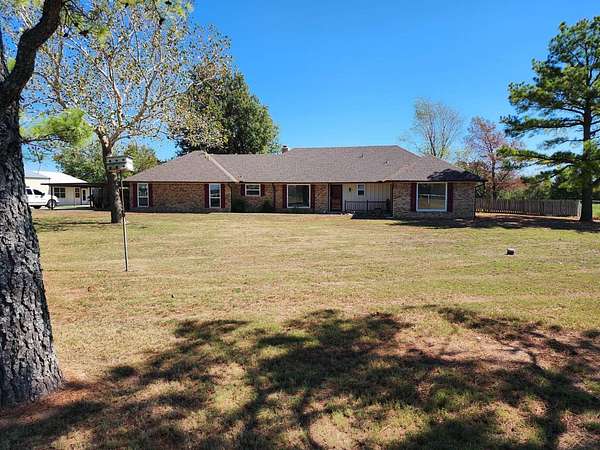 10 Acres of Land with Home for Auction in Prague, Oklahoma