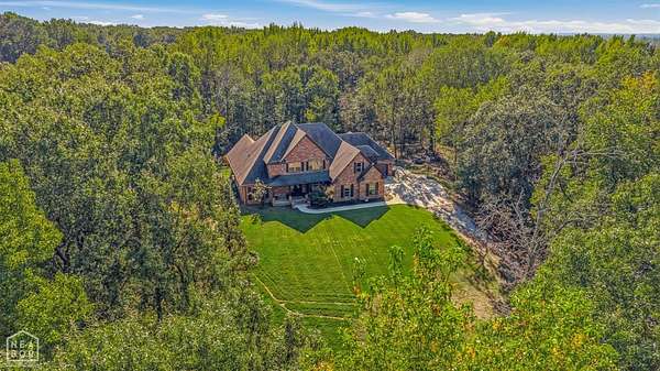 1.77 Acres of Land with Home for Sale in Bono, Arkansas